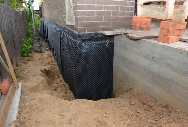 SJ Waterproofing Pros technician performing targeted Exterior Waterproofing assessment in Sunman, IN